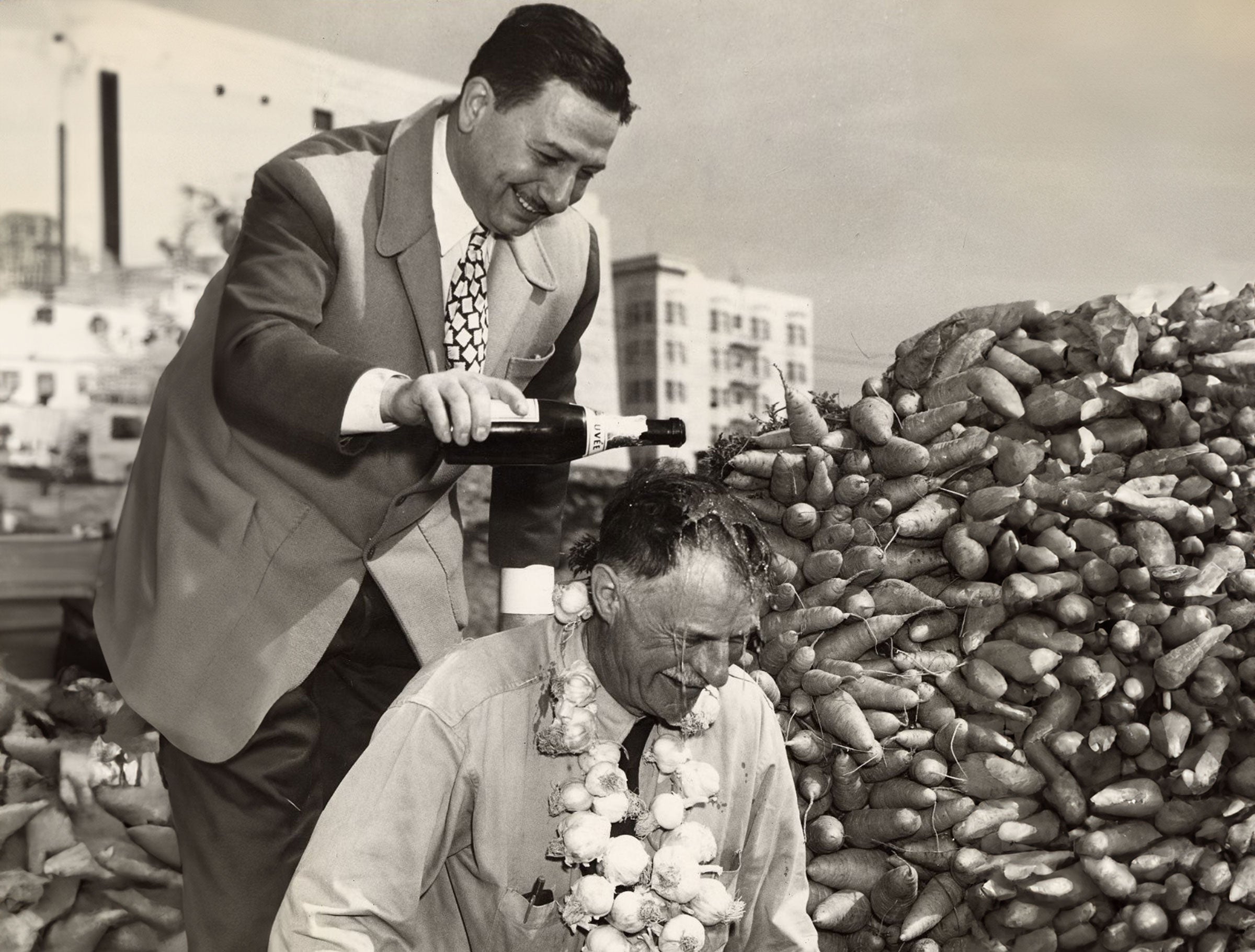 John Brucato pouring champagne on friend's head