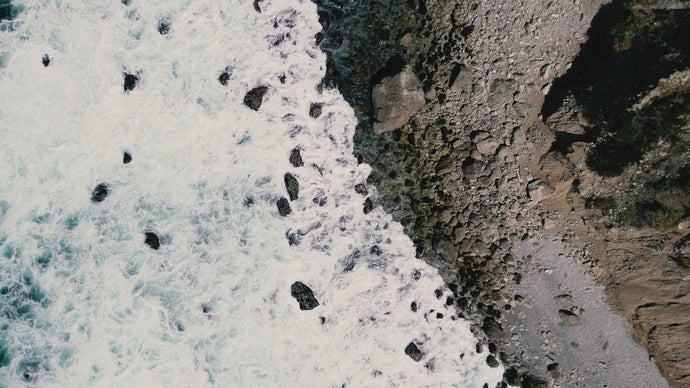 Overhead video of waves crashing on a beach in Big Sur